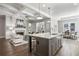 Open floor plan with kitchen island, Gathering room, and hardwood floors at 3909 Collarton Close Se, Smyrna, GA 30080