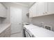 Bright laundry room with ample counter and cabinet space at 3909 Collarton Close Se, Smyrna, GA 30080