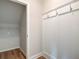 Convenient coat closet with shelving and hooks at 606 Somerset Ct, Loganville, GA 30052