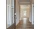 Bright entry hall with hardwood floors and access to other rooms at 606 Somerset Ct, Loganville, GA 30052