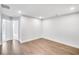 Bright bedroom with hardwood floors and neutral walls at 132 Briargate Dr, Johns Creek, GA 30097