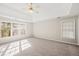 Main bedroom with high ceilings, large windows, and neutral decor at 3830 High Point Cir, Cumming, GA 30041