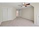 Bedroom with double door closet and carpet at 3830 High Point Cir, Cumming, GA 30041