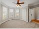 Bright bedroom with bay window and ceiling fan at 3830 High Point Cir, Cumming, GA 30041