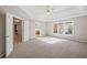 Main bedroom with high ceilings, large windows, and neutral decor at 3830 High Point Cir, Cumming, GA 30041