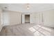 Main bedroom with high ceilings, large windows, and neutral decor at 3830 High Point Cir, Cumming, GA 30041