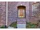 Traditional front door entry with brick accents at 3830 High Point Cir, Cumming, GA 30041