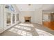 Sunlit Gathering room with stone fireplace and hardwood floors at 3830 High Point Cir, Cumming, GA 30041