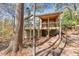 Two-story house with deck, porch, and walkway, nestled in woods at 3830 High Point Cir, Cumming, GA 30041