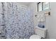 Updated bathroom with a shower/tub combo and butterfly shower curtain at 3193 Deshong Dr, Stone Mountain, GA 30087