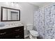 Modern bathroom with dark vanity and updated fixtures at 3193 Deshong Dr, Stone Mountain, GA 30087