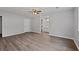 Spacious bedroom with wood-look floors and ensuite bathroom at 3193 Deshong Dr, Stone Mountain, GA 30087