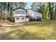 Back of house showing large deck and surrounding yard at 3193 Deshong Dr, Stone Mountain, GA 30087