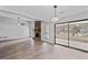 Bright living room featuring hardwood floors, stone fireplace and sliding glass doors at 3193 Deshong Dr, Stone Mountain, GA 30087