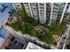 Aerial view of a lush green roof garden with walking paths and seating areas at 855 Peachtree St # 2205, Atlanta, GA 30308