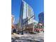 Contemporary high-rise building featuring expansive windows and a modern design in a vibrant urban setting at 855 Peachtree St # 2205, Atlanta, GA 30308