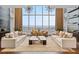 Sophisticated living room featuring floor-to-ceiling windows, stylish furniture, and modern decor at 855 Peachtree St # 2205, Atlanta, GA 30308