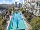 Stunning rooftop pool with city views, surrounded by lush greenery and comfortable lounging areas at 855 Peachtree St # 2205, Atlanta, GA 30308