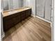 Bathroom showcasing double sinks, a shower, and attractive wood-look flooring at 3279 Wild Basil Ln, Buford, GA 30519