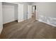 Bedroom featuring neutral carpet and a closet with double doors, offering ample storage space at 3279 Wild Basil Ln, Buford, GA 30519