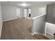 Second floor bonus room with a view to another bedroom via the hallway at 3279 Wild Basil Ln, Buford, GA 30519
