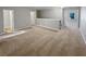 Spacious bonus room showcasing neutral walls, carpet, and plenty of natural light at 3279 Wild Basil Ln, Buford, GA 30519