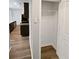 View into closet features a shelf and door with a view of the kitchen at 3279 Wild Basil Ln, Buford, GA 30519
