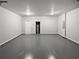 Clean, oversized two-car garage with sealed floor and water heater at 3279 Wild Basil Ln, Buford, GA 30519