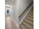 Entryway with wood-look floors, stairs with carpet, and natural light at 3279 Wild Basil Ln, Buford, GA 30519
