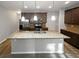 Modern kitchen with granite countertops, stainless steel appliances, and a large center island at 3279 Wild Basil Ln, Buford, GA 30519