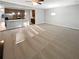 Open-concept living space with carpet flooring, connecting to kitchen with stainless appliances at 3279 Wild Basil Ln, Buford, GA 30519