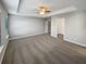 Expansive main bedroom boasting neutral walls, carpet, tray ceiling, and walk-in closet at 3279 Wild Basil Ln, Buford, GA 30519
