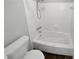Clean, white bathroom with a tub-shower combo, modern shower head, and efficient toilet design at 504 Vicksburg Pl, Atlanta, GA 30350