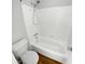 Clean bathroom with a tiled shower and bathtub combination and updated fixtures at 504 Vicksburg Pl, Atlanta, GA 30350