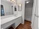 Clean bathroom with a large mirror, white vanity, and a combined shower and tub at 504 Vicksburg Pl, Atlanta, GA 30350