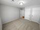 Spacious bedroom with large closets, neutral tones, and plush carpeting at 504 Vicksburg Pl, Atlanta, GA 30350