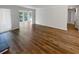 Bright living room showcasing beautiful flooring and access to an outdoor patio at 504 Vicksburg Pl, Atlanta, GA 30350