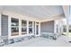 Covered back patio with stone and gray siding at 112 Laurel Farms Ln, Dallas, GA 30157