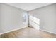 Bedroom featuring wood-look flooring, window, and neutral paint at 112 Laurel Farms Ln, Dallas, GA 30157