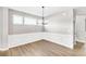 Bright dining room with wainscoting and hardwood floors at 112 Laurel Farms Ln, Dallas, GA 30157