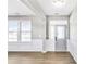 Front entry with gray door and wainscoting at 112 Laurel Farms Ln, Dallas, GA 30157