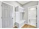 Entryway with bench, cubbies, and access to the bathroom at 112 Laurel Farms Ln, Dallas, GA 30157