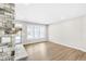 Gathering room with stone fireplace and hardwood floors at 112 Laurel Farms Ln, Dallas, GA 30157