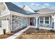 House exterior with stone and gray siding, plus porch at 112 Laurel Farms Ln, Dallas, GA 30157