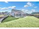 Gray house exterior with stone accents and covered patio at 112 Laurel Farms Ln, Dallas, GA 30157