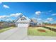 House exterior with gray siding and two-car garage at 112 Laurel Farms Ln, Dallas, GA 30157