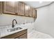 Laundry room with sink, cabinets, and granite countertop at 112 Laurel Farms Ln, Dallas, GA 30157