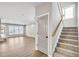 Open-concept living room with stairs and fireplace, perfect for gatherings at 112 Laurel Farms Ln, Dallas, GA 30157