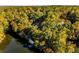 House nestled in trees near lake at 8316 Hewlett Rd, Sandy Springs, GA 30350