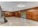 Spacious basement room with wood paneling and tile floor at 8316 Hewlett Rd, Sandy Springs, GA 30350
